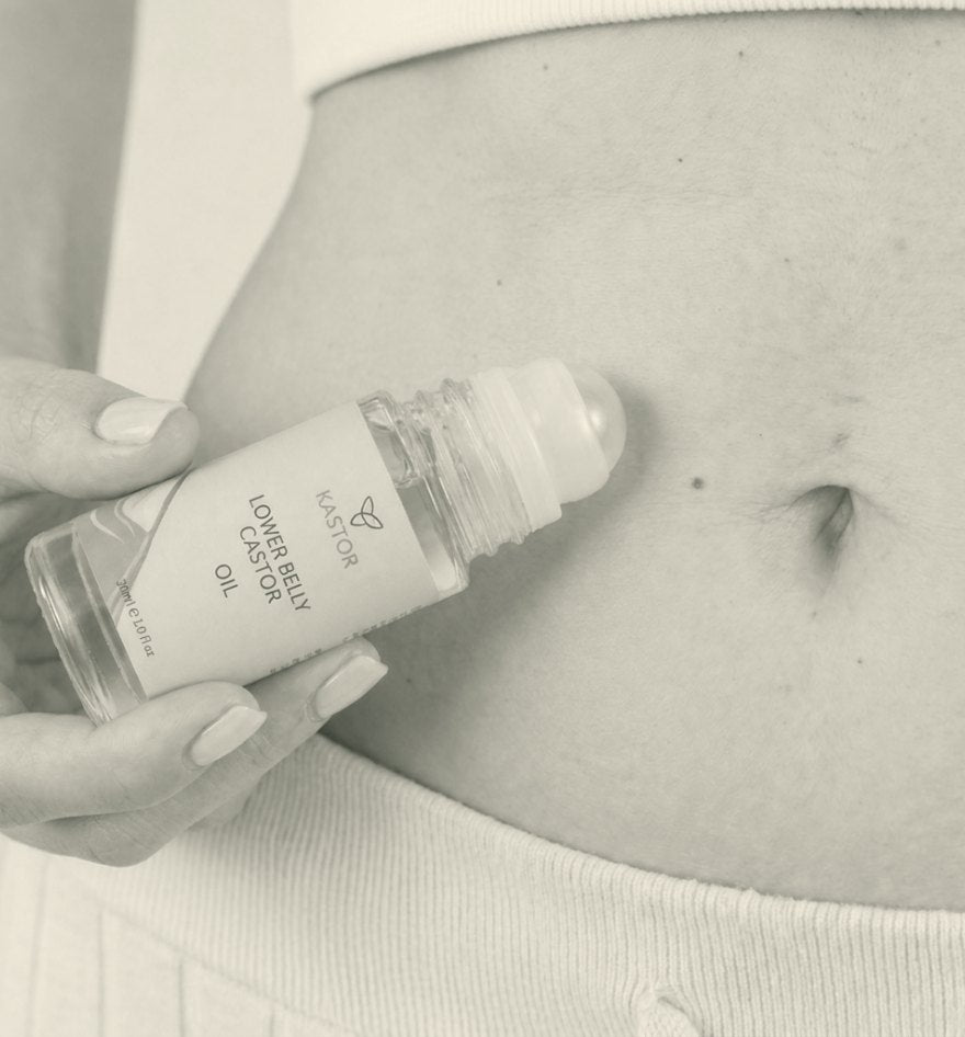 A hand holding the Kastor roller against a lower belly